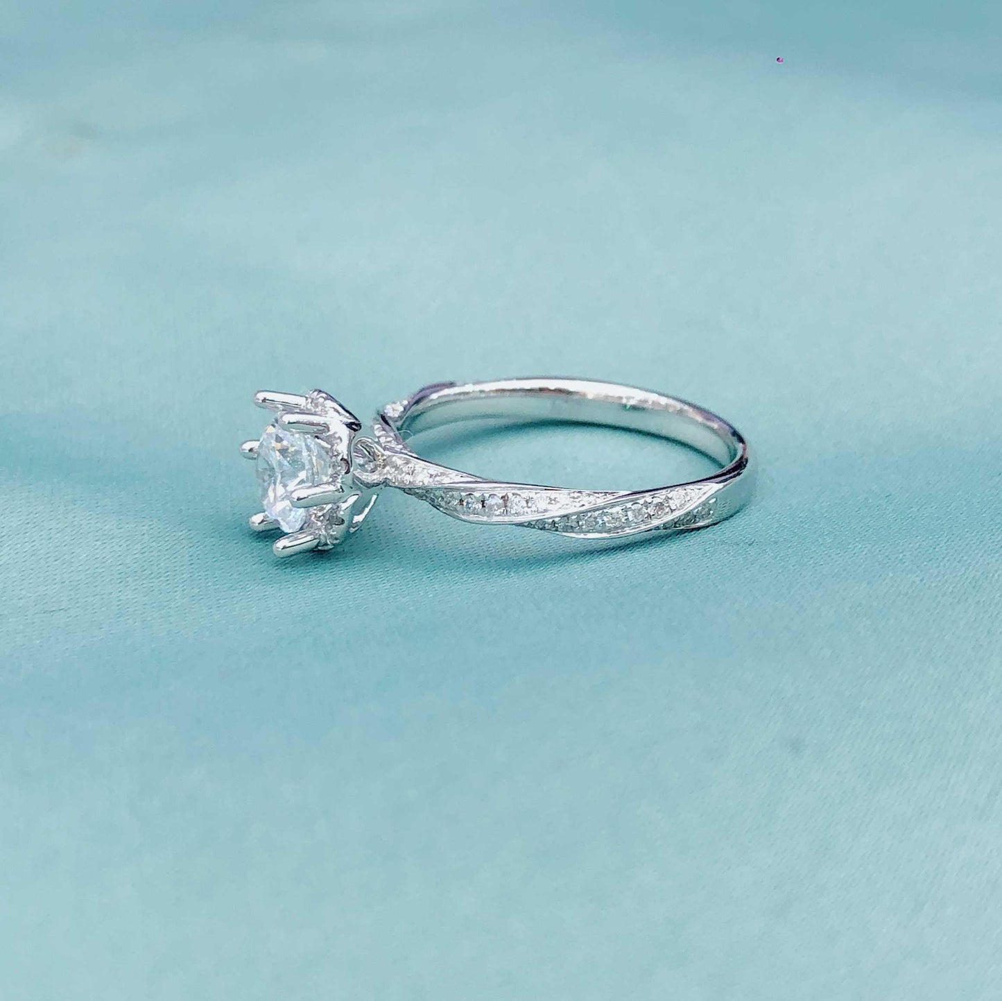 Glacial Muse – 18K White Gold Three-Stone Ring with 2ct Center & Diamond Pavé