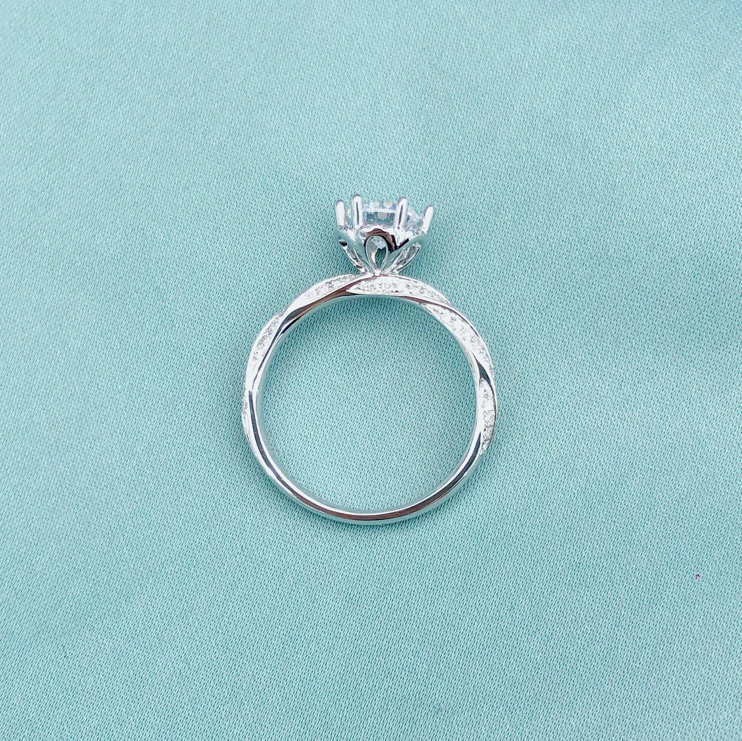 Glacial Muse – 18K White Gold Three-Stone Ring with 2ct Center & Diamond Pavé
