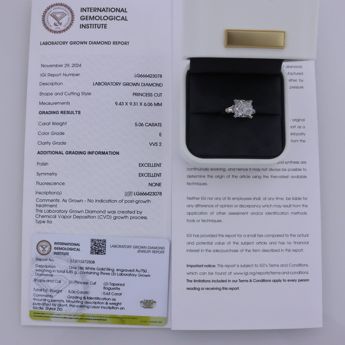 Diamond ring in a box with an International Gemological Institute report on a white background