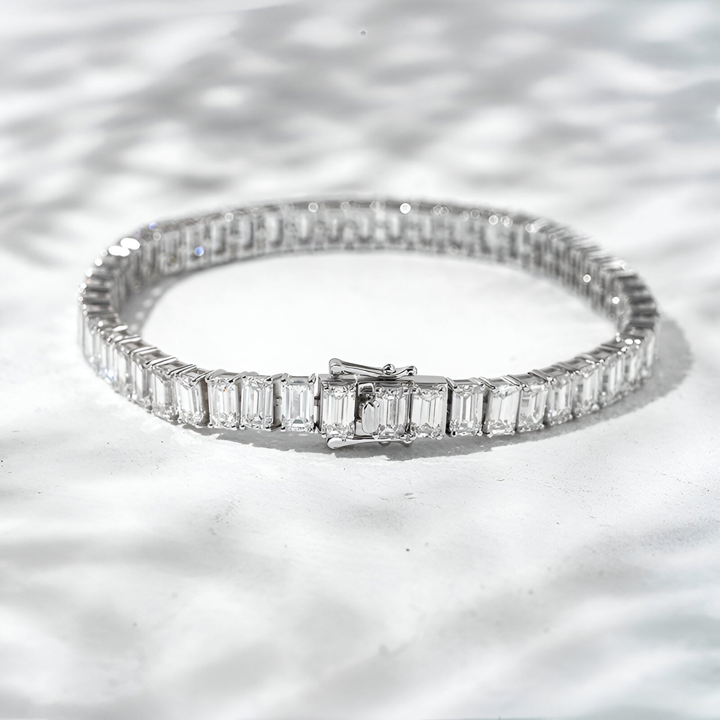 Diamond bracelet on a textured white surface