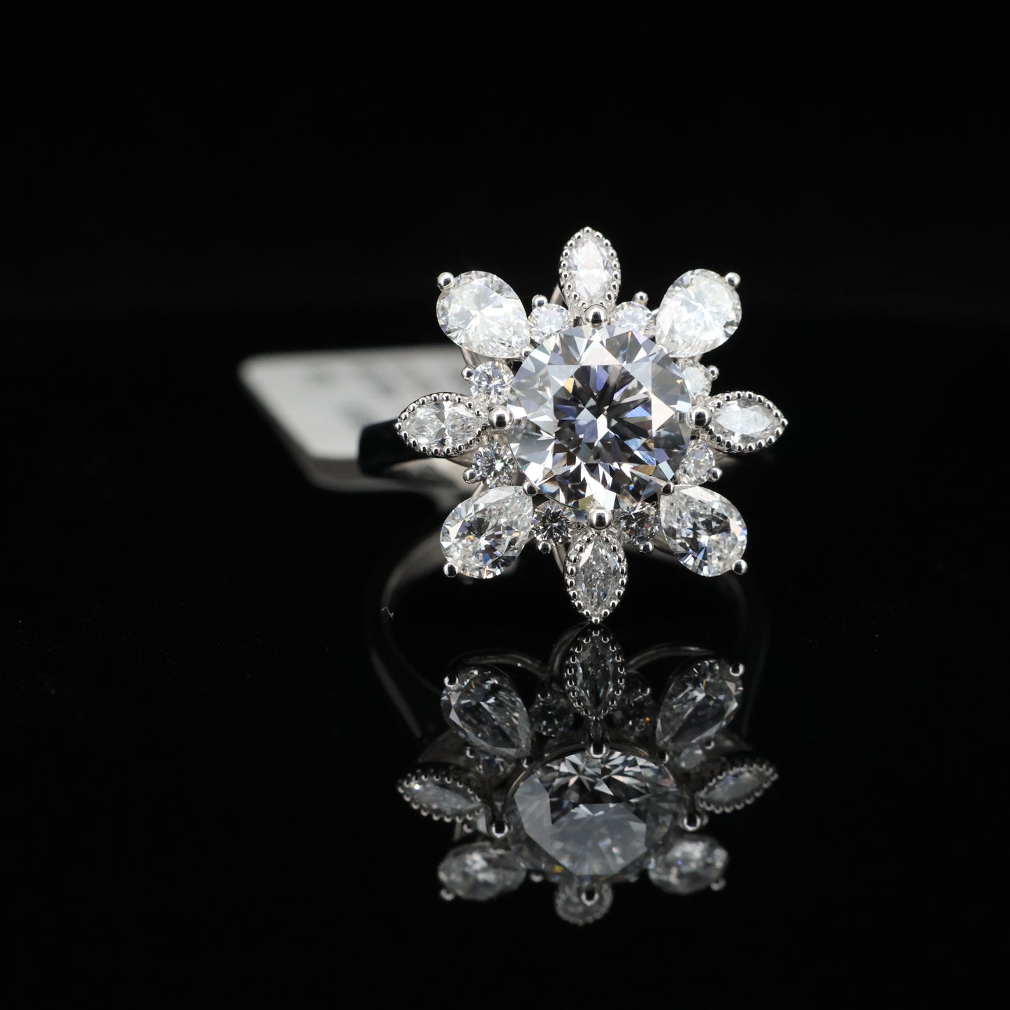 Diamond ring with floral design on a black background