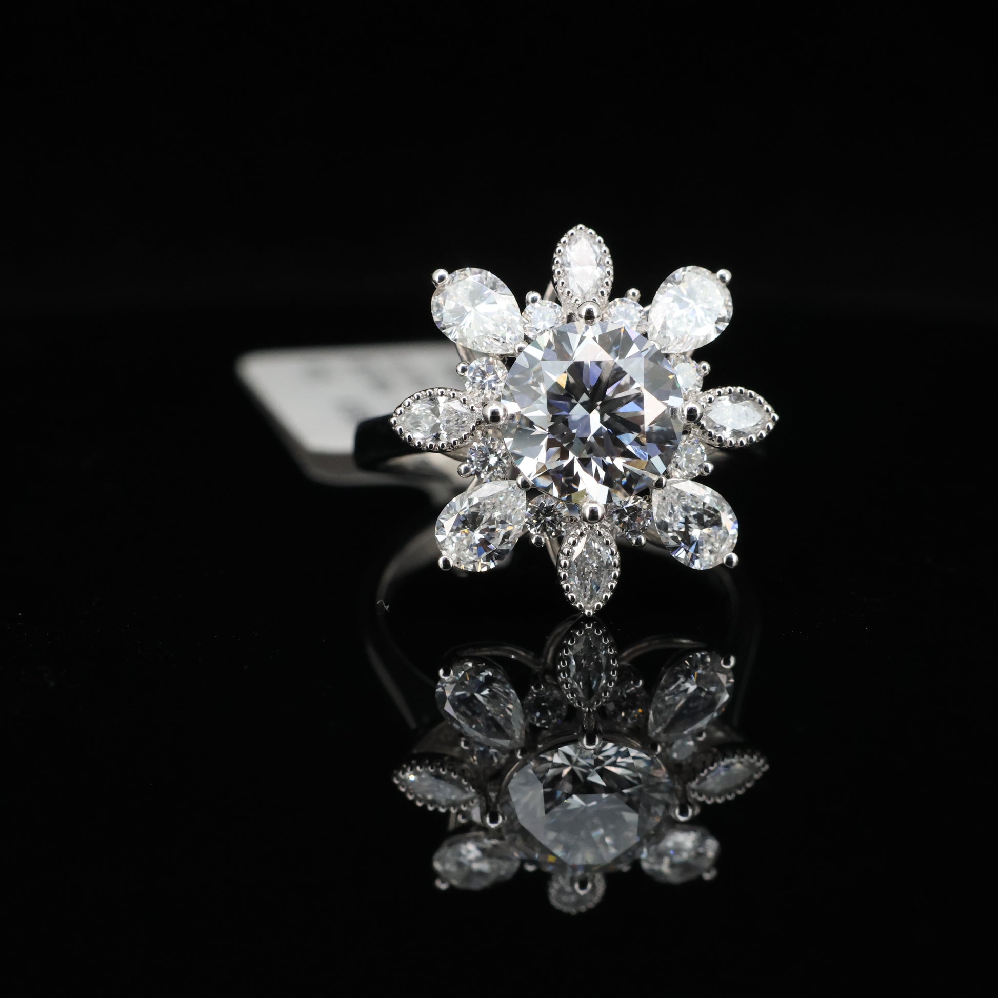 Diamond ring with floral design on a black background