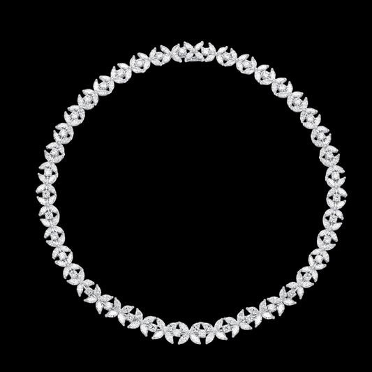 Silver necklace with clear stones on a black background