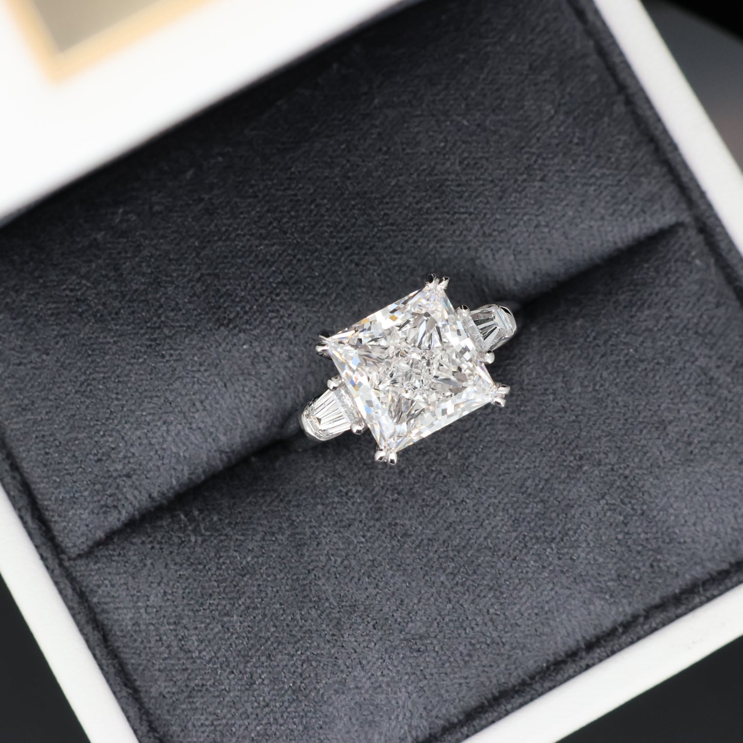 Diamond ring in a gray jewelry box