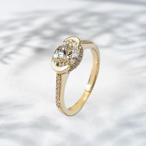 Royal Drip – 18K Yellow Gold Natural Diamond Oval Halo Ring (1.2 ct)