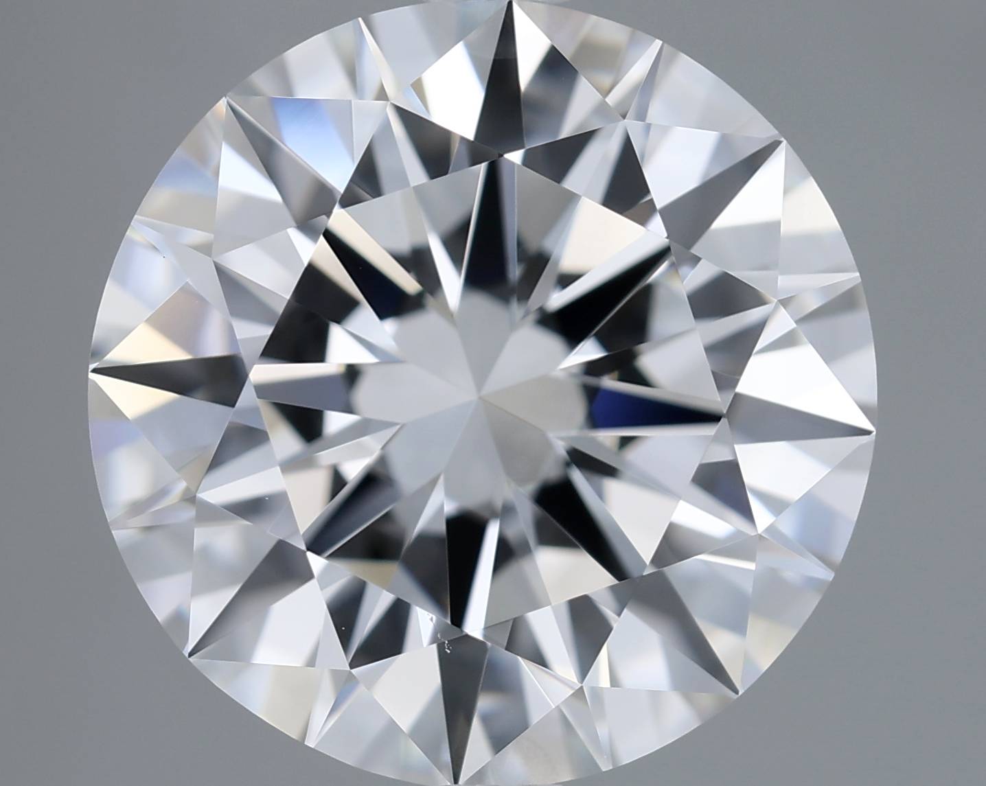 Close-up of a round diamond with a gray background