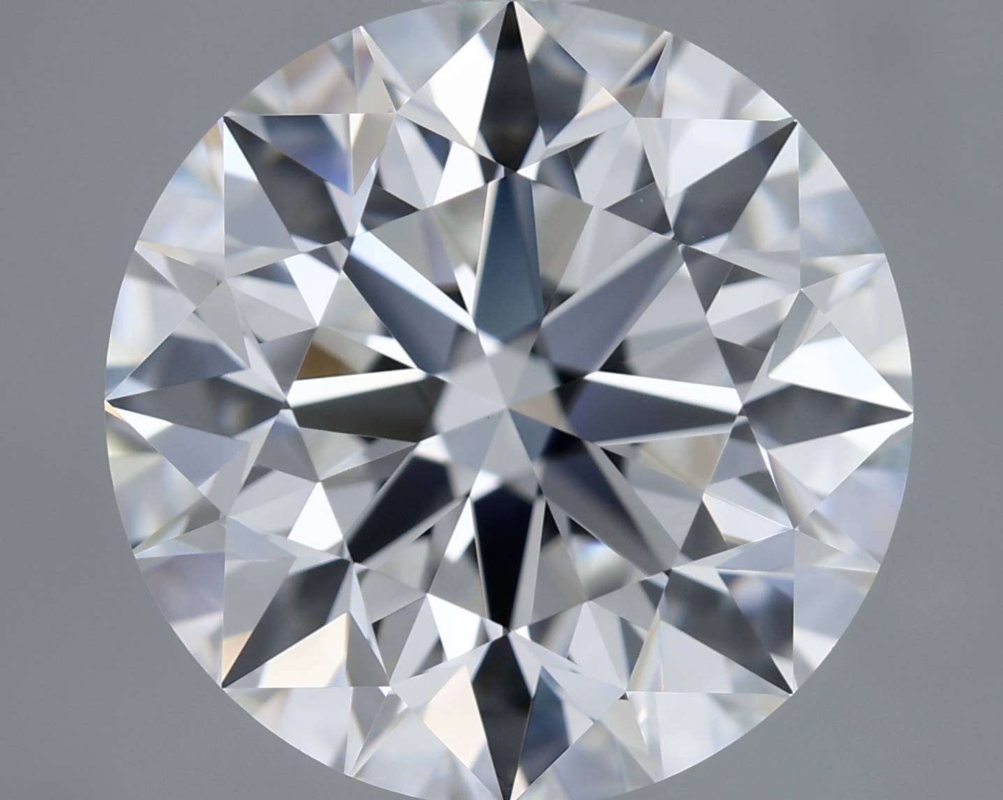 Close-up of a round diamond with a gray background