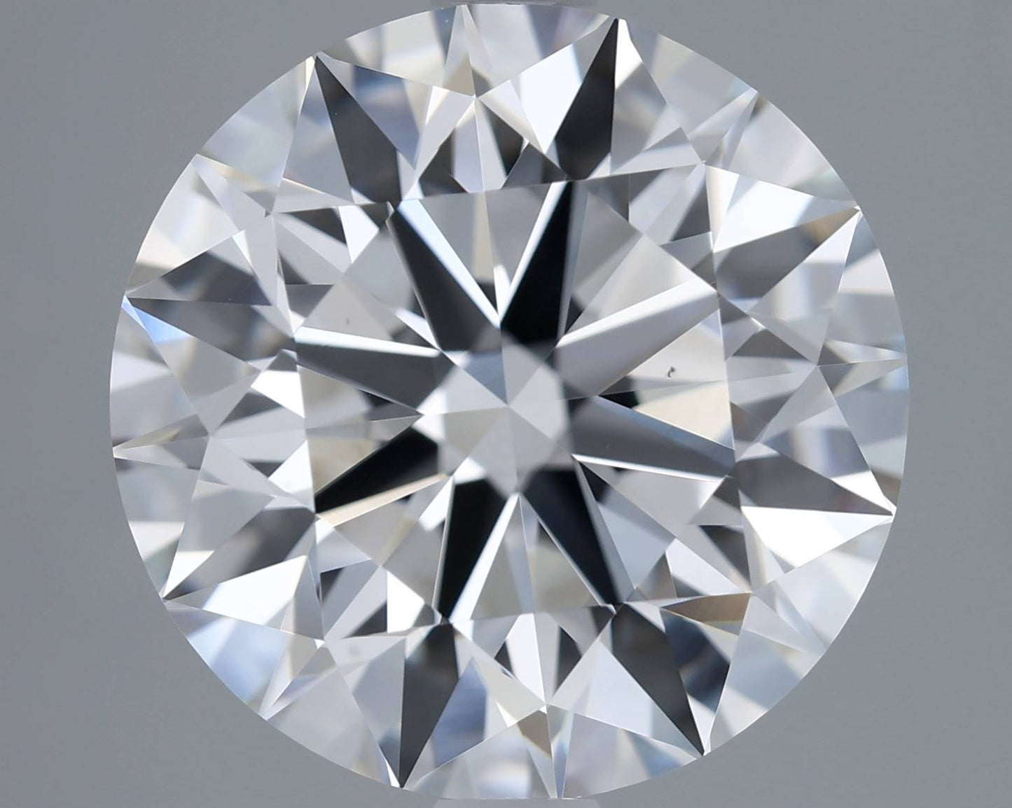 Close-up of a round diamond with a gray background