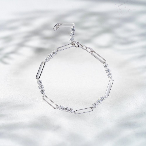 Silver bracelet with geometric design on a light background