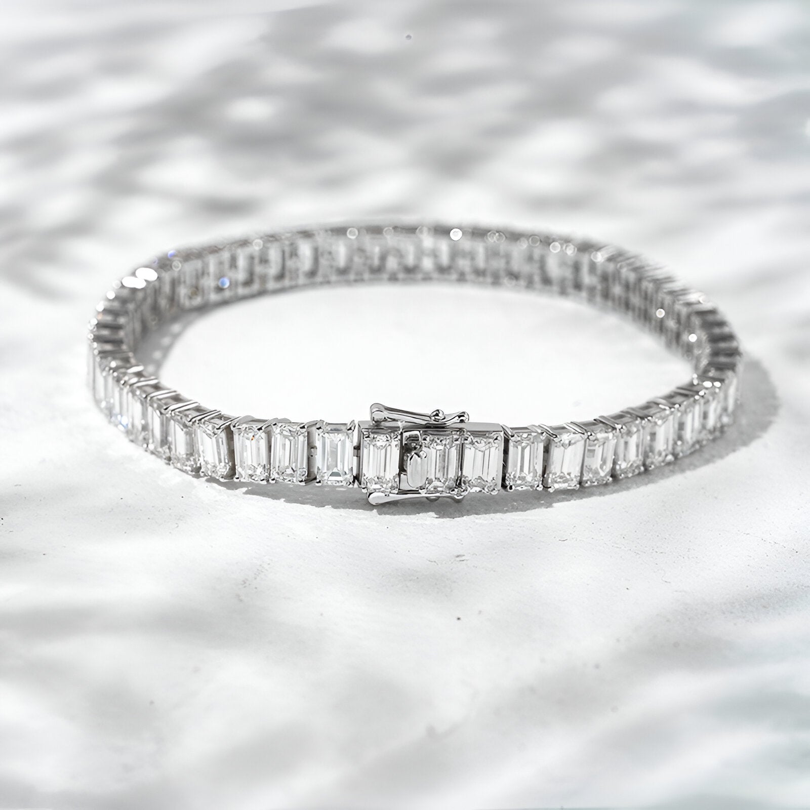Diamond bracelet on a textured white surface