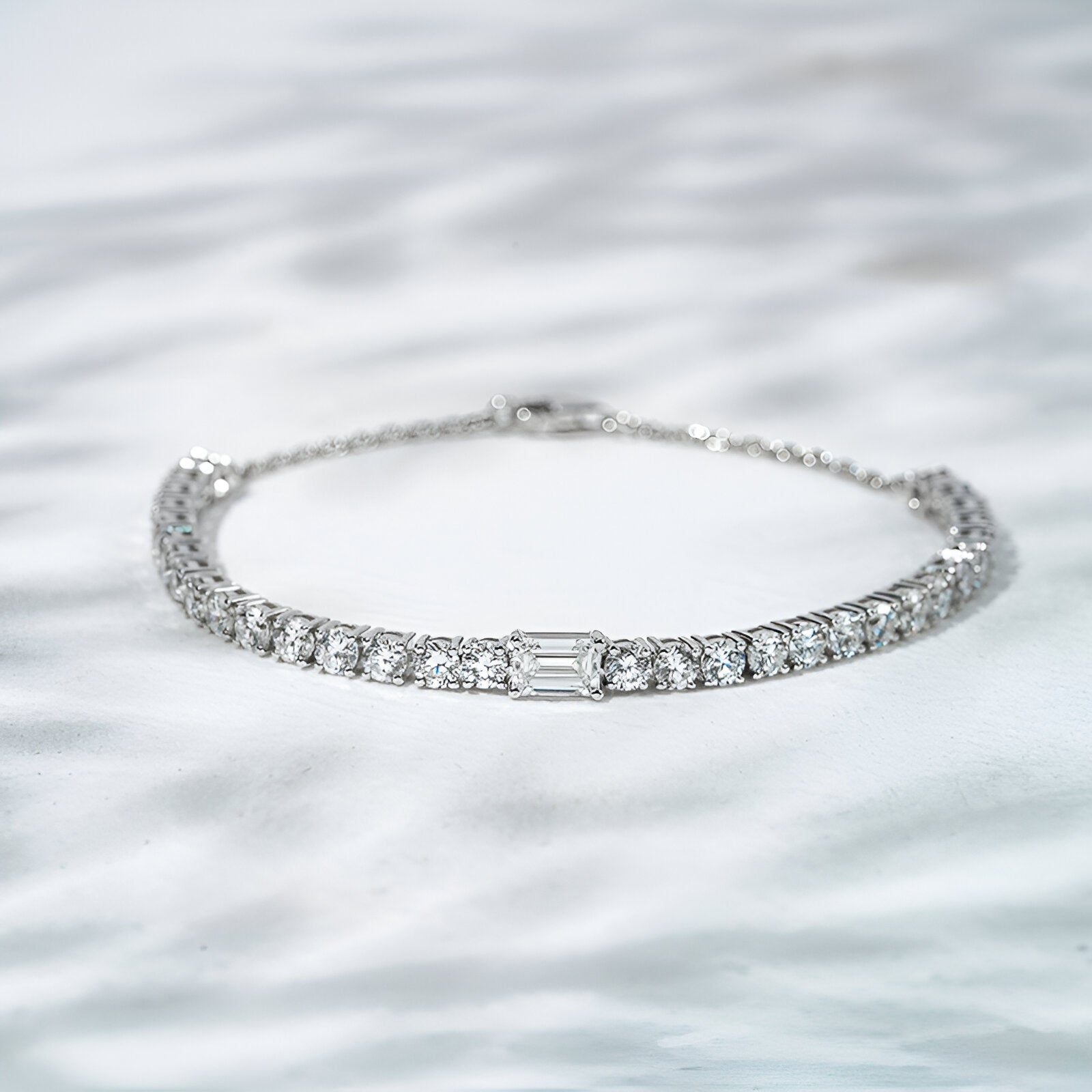 Silver bracelet with diamonds on a white background