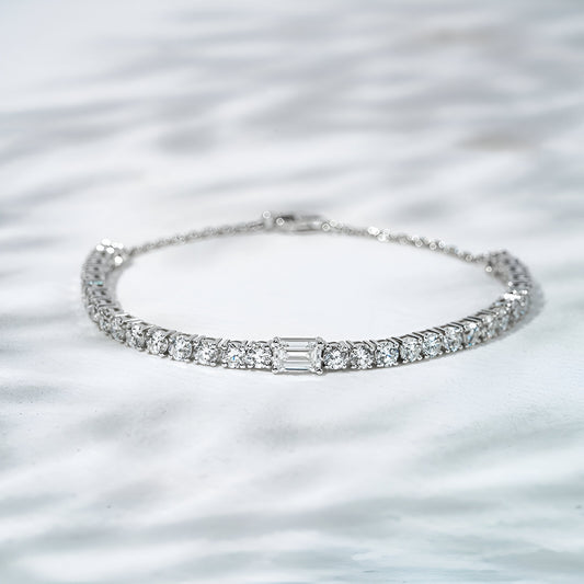 Silver bracelet with diamonds on a white background