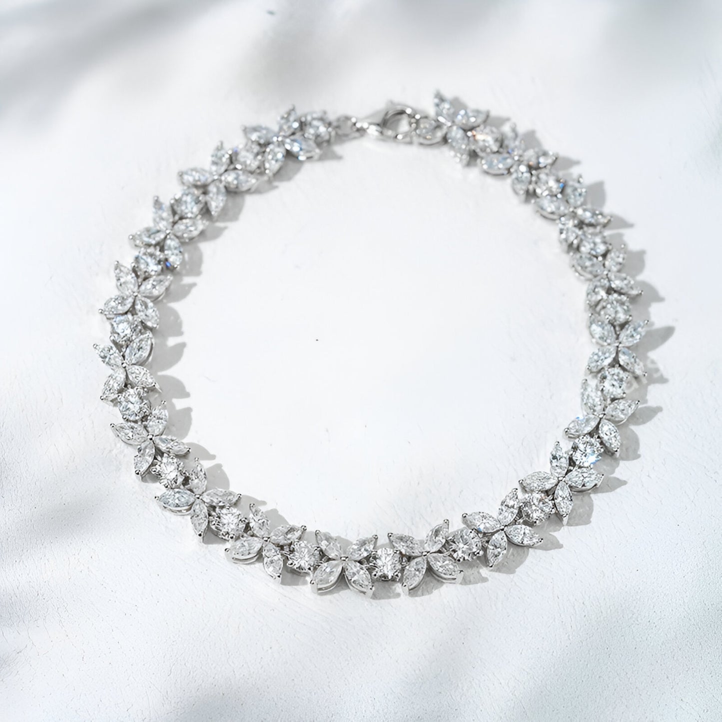 Diamond necklace on a white satin background