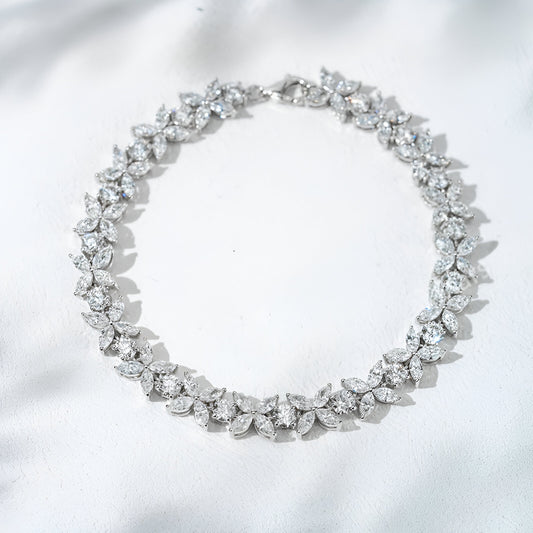Diamond necklace on a white satin background