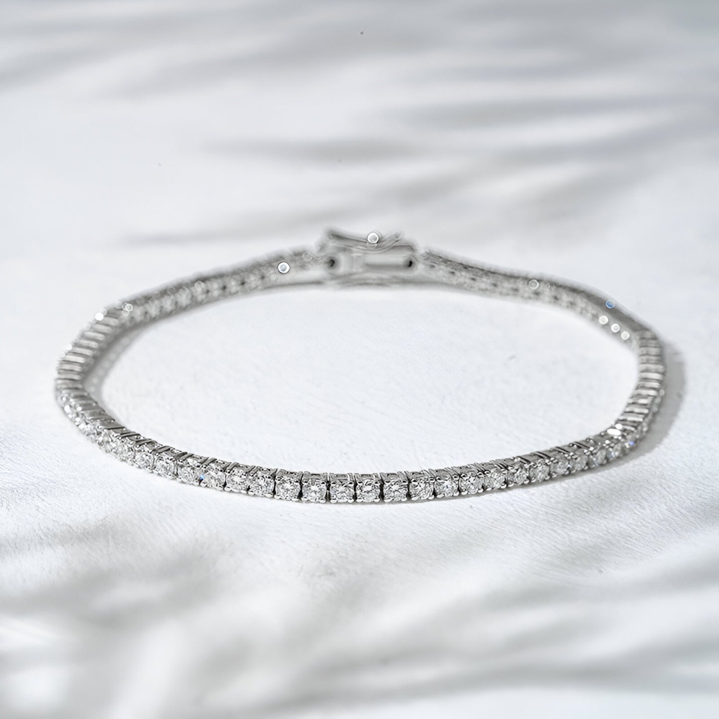 Diamond bracelet on a white fabric background