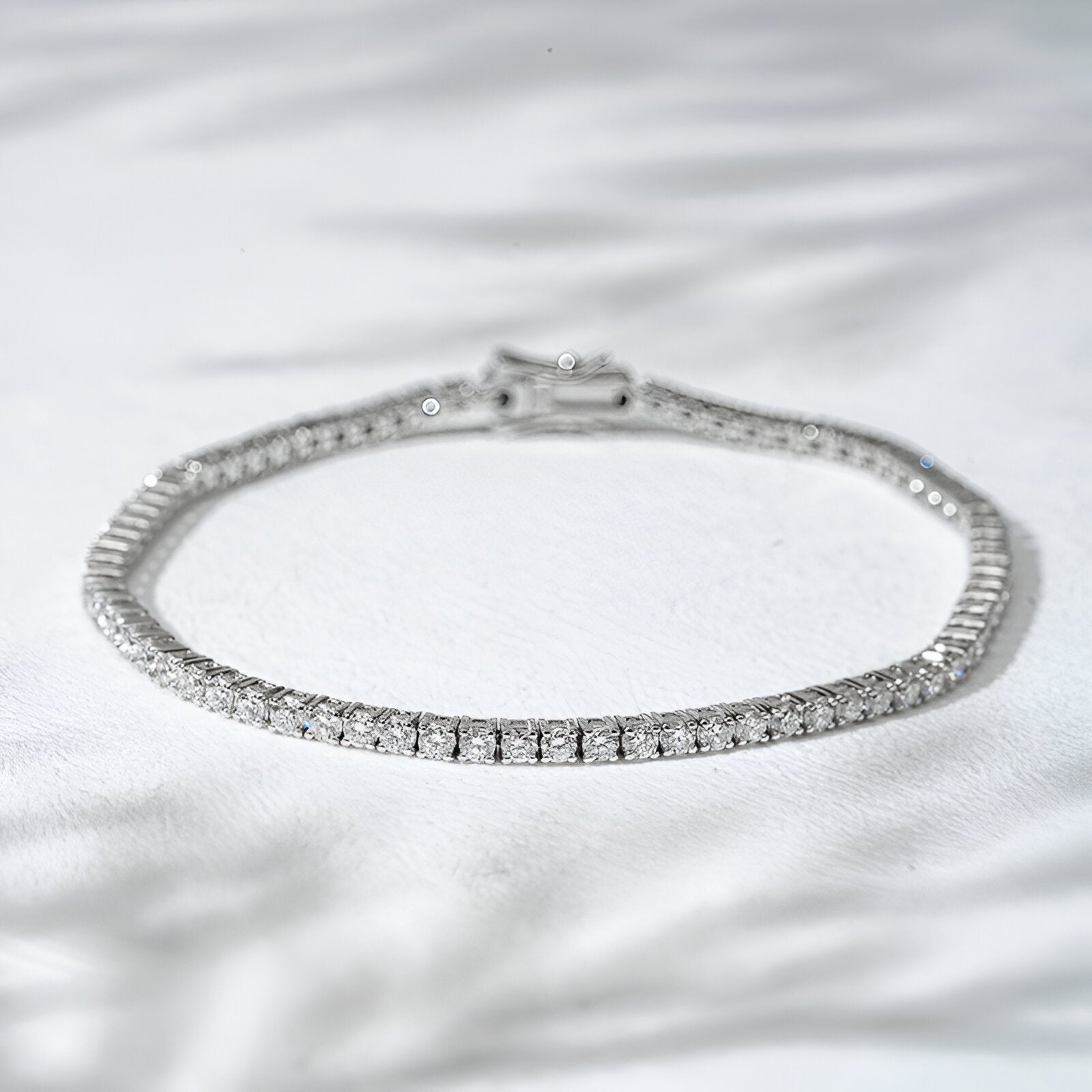Diamond bracelet on a white fabric background