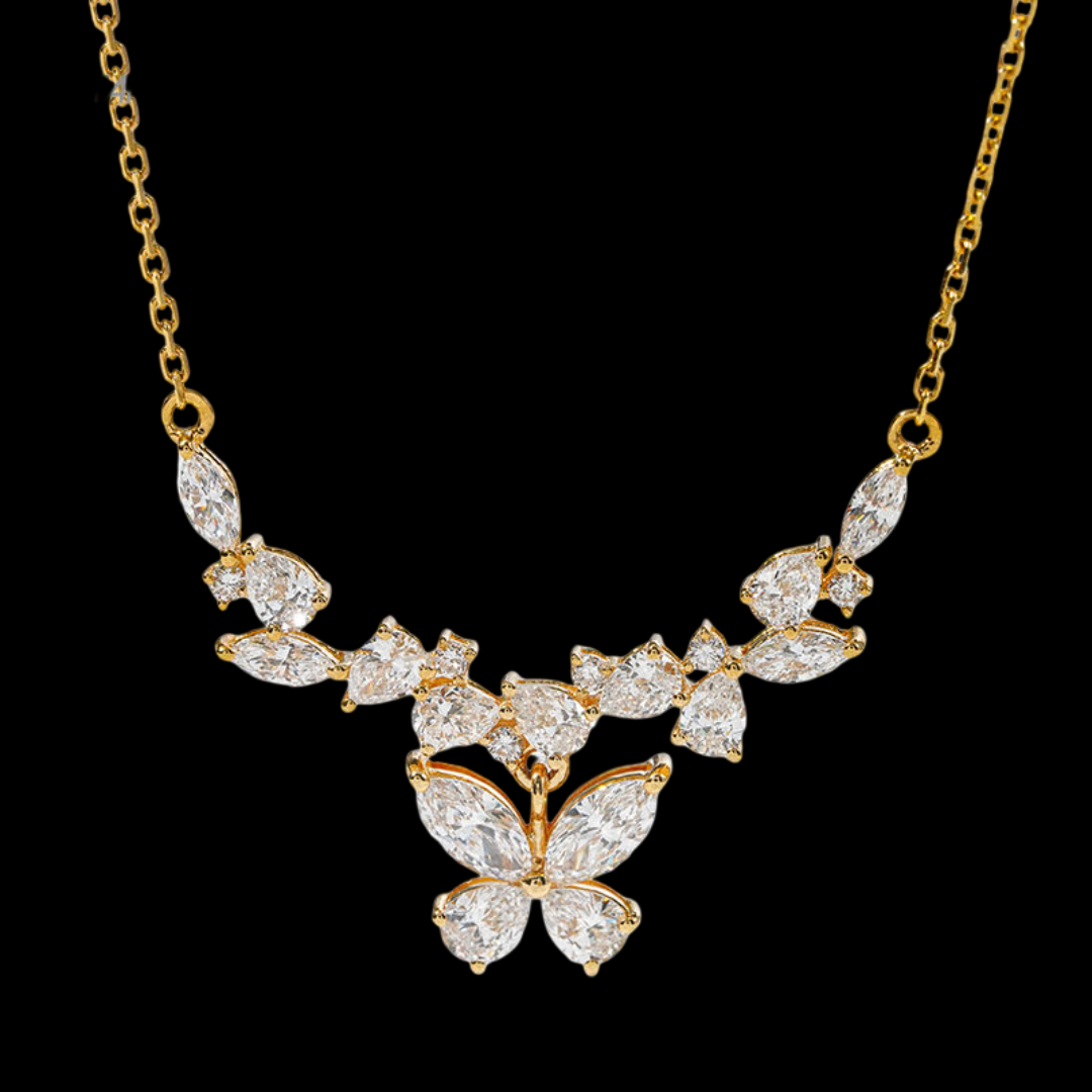 Gold necklace with butterfly pendant on a black background