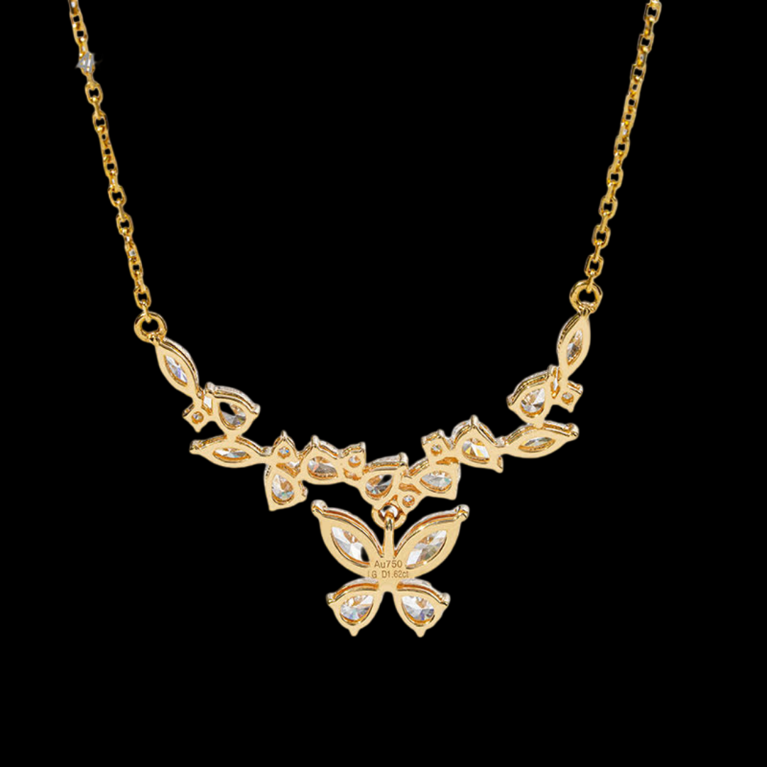 Gold necklace with butterfly pendant on a black background