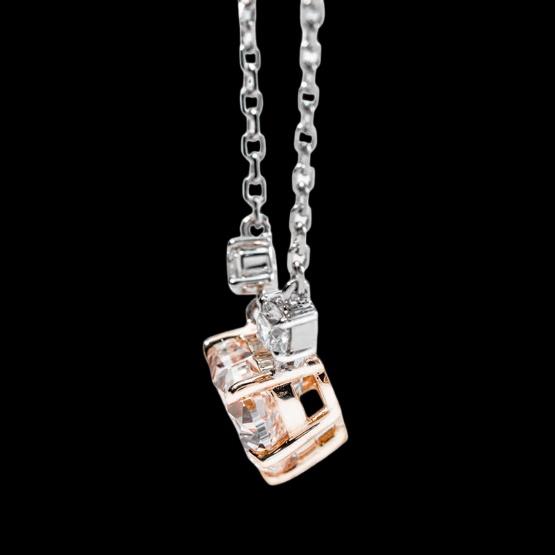 Diamond-encrusted pendant on a chain against a black background