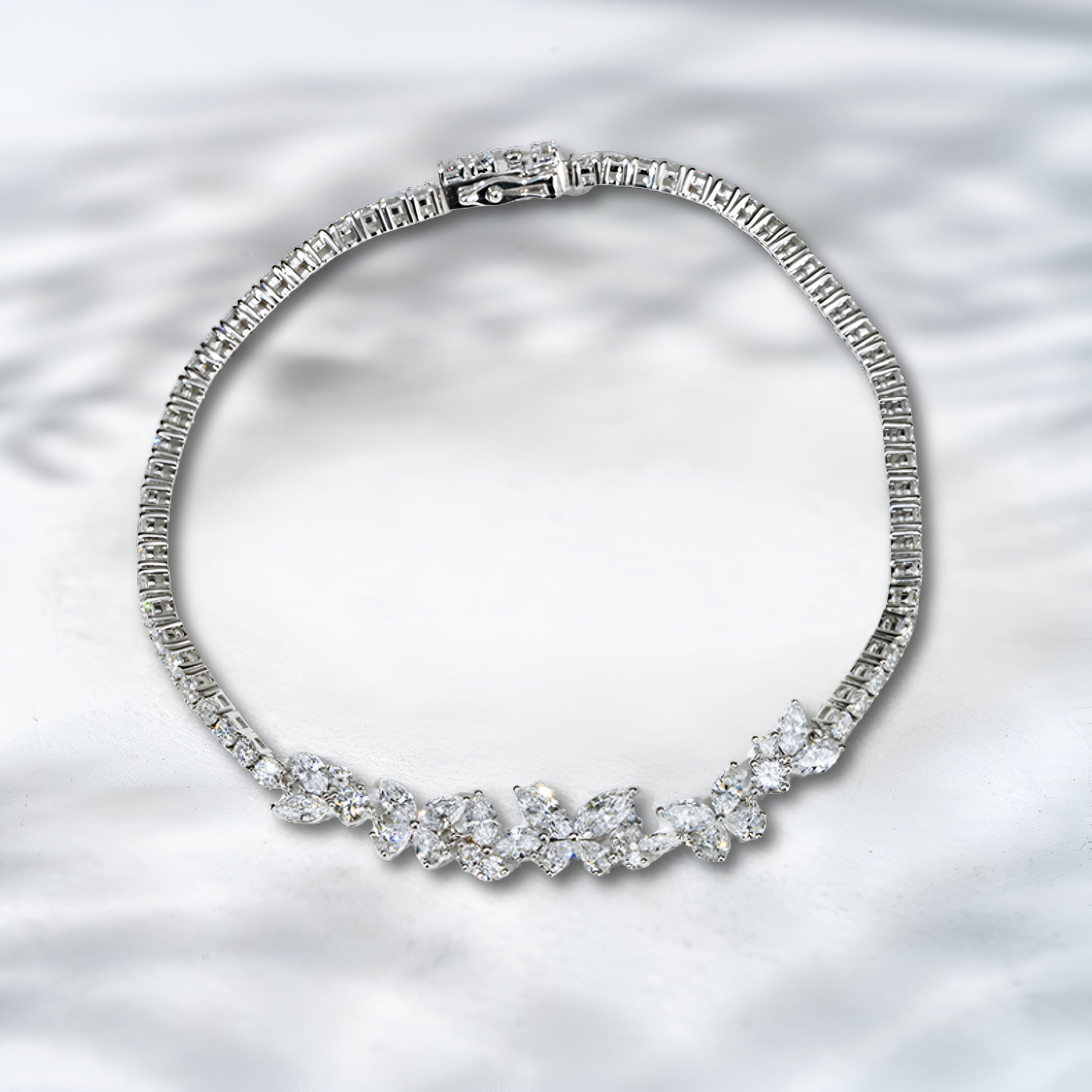 Diamond bracelet on a textured silver background