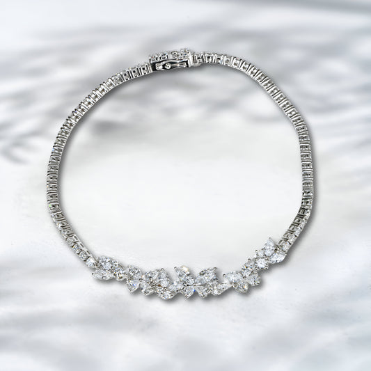Diamond bracelet on a textured silver background