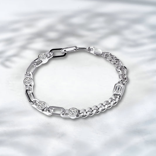 Silver bracelet with embedded diamonds on a textured silver background