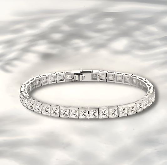 Diamond bracelet on a reflective silver background